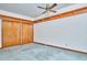 Bedroom featuring carpet flooring, wooden trim and double closet at 37 Wedgewood Rd, Chapel Hill, NC 27514