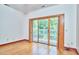 Bedroom with hardwood flooring and sliding doors to the outside balcony at 37 Wedgewood Rd, Chapel Hill, NC 27514