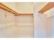 Spacious empty closet with wood shelving is ready for all your storage needs at 37 Wedgewood Rd, Chapel Hill, NC 27514