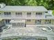 Aerial view of the backyard with a stone patio, covered pool and a hot tub at 37 Wedgewood Rd, Chapel Hill, NC 27514