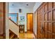 Inviting foyer with hardwood floors and trim showcases a traditional-style entrance at 37 Wedgewood Rd, Chapel Hill, NC 27514