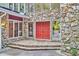 Inviting front entrance with double doors, stone accents, and lots of natural light at 37 Wedgewood Rd, Chapel Hill, NC 27514