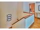 Upstairs hallway with hardwood floors and decorative wall art create an inviting space at 37 Wedgewood Rd, Chapel Hill, NC 27514