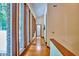 Hallway with hardwood floors and large windows offering panoramic views and ample natural light at 37 Wedgewood Rd, Chapel Hill, NC 27514