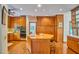 Spacious kitchen with a central island, wood cabinets, and modern appliances at 37 Wedgewood Rd, Chapel Hill, NC 27514