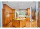 Spacious kitchen with a central island, wood cabinets, and modern appliances at 37 Wedgewood Rd, Chapel Hill, NC 27514