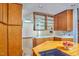 Kitchen space with skylight and view into another room with skylight and kitchen island at 37 Wedgewood Rd, Chapel Hill, NC 27514