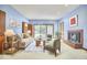 Bright living room boasts a fireplace, seating area, and sliding glass doors to the outdoors at 37 Wedgewood Rd, Chapel Hill, NC 27514