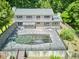 Home featuring a large in-ground pool, patio, balconies and scenic wooded surroundings at 37 Wedgewood Rd, Chapel Hill, NC 27514