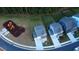 Overhead shot showing a light blue home near a playground and fenced yard in a neighborhood at 391 Curling Creek Dr Dr, Clayton, NC 27527