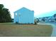 Exterior of a light blue house with a spacious backyard, perfect for outdoor living at 391 Curling Creek Dr Dr, Clayton, NC 27527