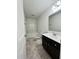 Bathroom with a dark vanity and a shower at 391 Curling Creek Dr Dr, Clayton, NC 27527