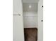 Walk-in closet featuring wire shelving and neutral carpet, offering ample storage space at 391 Curling Creek Dr Dr, Clayton, NC 27527