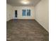 Spacious living room with plenty of natural light, wood-look flooring, and a back door at 391 Curling Creek Dr Dr, Clayton, NC 27527