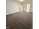 Large main bedroom showcasing neutral carpet and a bathroom entrance at 391 Curling Creek Dr Dr, Clayton, NC 27527