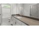 This bathroom features gray countertops, white cabinets, shower, and patterned flooring at 40 W Victoria Ridge Dr # 18, Selma, NC 27576