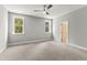 Bedroom features natural light, a ceiling fan, gray walls, carpet flooring, and base molding at 40 W Victoria Ridge Dr # 18, Selma, NC 27576
