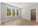 Well-lit bedroom boasting natural light, neutral walls, and hardwood flooring at 40 W Victoria Ridge Dr # 18, Selma, NC 27576