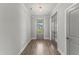 Bright entryway featuring hardwood flooring, neutral walls, and a view through the front door at 40 W Victoria Ridge Dr # 18, Selma, NC 27576