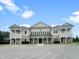 Classic building featuring a symmetrical facade, white columns, and well-manicured landscaping at 40 W Victoria Ridge Dr # 18, Selma, NC 27576