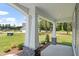 Wide front porch with stone accents and sturdy white support pillars provides ample outdoor space at 40 W Victoria Ridge Dr # 18, Selma, NC 27576