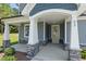 Close-up shot of an inviting front porch with gray stone accents and sturdy white support pillars at 40 W Victoria Ridge Dr # 18, Selma, NC 27576
