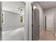 Hallway view into bedroom with ceiling fan and bright windows, and open walk-in closet at 40 W Victoria Ridge Dr # 18, Selma, NC 27576