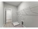 A laundry room features vinyl flooring, wire shelving, and washer/dryer hookups at 40 W Victoria Ridge Dr # 18, Selma, NC 27576