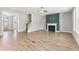 Spacious open-concept living area with a modern fireplace and adjacent staircase at 40 W Victoria Ridge Dr # 18, Selma, NC 27576