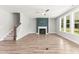 Bright living room features a modern fireplace, ceiling fan and multiple windows at 40 W Victoria Ridge Dr # 18, Selma, NC 27576