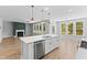 Open-concept living area features a fireplace, abundant windows, and modern lighting fixtures at 40 W Victoria Ridge Dr # 18, Selma, NC 27576