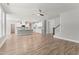 Open concept living room flows into a modern kitchen with sleek white cabinets at 40 W Victoria Ridge Dr # 18, Selma, NC 27576