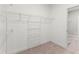 Spacious walk-in closet providing ample storage with shelves and hanging rods at 40 W Victoria Ridge Dr # 18, Selma, NC 27576