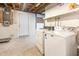 Unfinished basement laundry area with washer and dryer at 421 Ridgefield Rd Rd, Chapel Hill, NC 27517