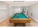 Basement game room with pool table, wood stove, and built in cabinets at 421 Ridgefield Rd Rd, Chapel Hill, NC 27517