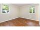 Bedroom featuring hardwood floors and bright windows with natural light at 421 Ridgefield Rd Rd, Chapel Hill, NC 27517