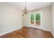 Open dining area with chandelier and access to a wooden deck through glass doors at 421 Ridgefield Rd Rd, Chapel Hill, NC 27517