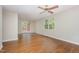 Bright living room featuring hardwood floors, a ceiling fan, and a view of the deck at 421 Ridgefield Rd Rd, Chapel Hill, NC 27517