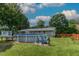 The above-ground pool and deck enhances outdoor living in the large backyard with mature trees and landscaping at 444 Barnette Rd, Louisburg, NC 27549