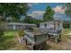 Landscaped backyard featuring raised garden beds and a greenhouse, showcasing a perfect space for gardening enthusiasts at 444 Barnette Rd, Louisburg, NC 27549