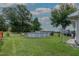 The above-ground pool surrounded by grassy lawn offers a private oasis for relaxation and outdoor enjoyment at 444 Barnette Rd, Louisburg, NC 27549