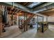Unfinished basement with exposed beams and duct work, offering potential for storage or customization at 444 Barnette Rd, Louisburg, NC 27549