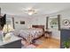 Cozy bedroom featuring a comfortable bed, warm lighting and stylish decor at 444 Barnette Rd, Louisburg, NC 27549
