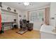 Inviting room with hardwood floors and plenty of space for a functional home office setup at 444 Barnette Rd, Louisburg, NC 27549