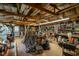 Well-lit and organized garage with ample storage space, workbenches, and a variety of tools for projects at 444 Barnette Rd, Louisburg, NC 27549