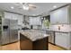 Contemporary kitchen with stainless steel appliances, island with countertop, and stylish cabinets at 444 Barnette Rd, Louisburg, NC 27549
