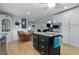 Open kitchen featuring an island with seating, plenty of cabinet space and modern appliances at 444 Barnette Rd, Louisburg, NC 27549