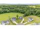 Aerial view of homes with well-kept lawns and surrounded by lush green trees at 45 Leighann S Ct, Timberlake, NC 27583