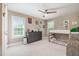 Cozy bedroom with bunk beds, ceiling fan, dresser, and natural light from two windows at 45 Leighann S Ct, Timberlake, NC 27583