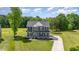 Charming two-story home with a landscaped yard and long driveway on a sunny day at 45 Leighann S Ct, Timberlake, NC 27583